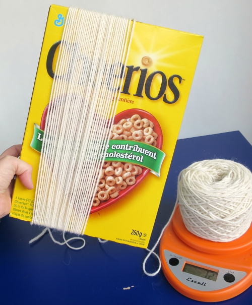 using a cereal box to wind yarn